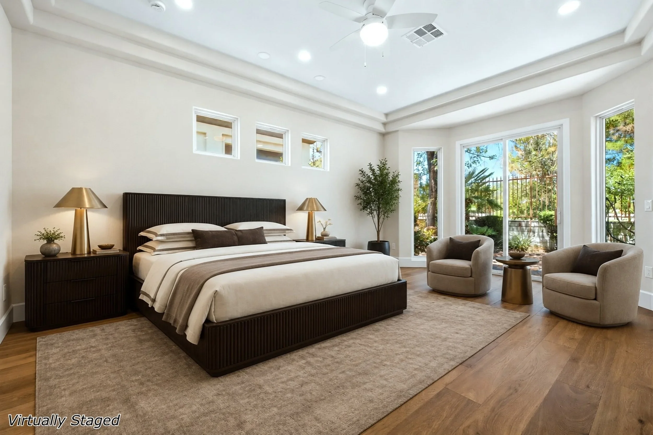 Luxury bedroom with coffered ceiling, hardwood floors, French doors, and built-in millwork